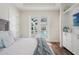 The main bedroom has stylish, walk-out access to the pool and screen patio area at 8752 Loft Pt, Wesley Chapel, FL 33545