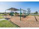 A colorful playground with slides, swings, and climbing structures provides outdoor fun for residents at 8752 Loft Pt, Wesley Chapel, FL 33545