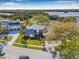 Stately home with lush landscaping and a sprawling lawn offers curb appeal and a beautiful neighborhood setting at 9011 Baywood Park Dr, Seminole, FL 33777