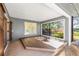 Outdoor lanai featuring wood deck with views of backyard landscaping at 9011 Baywood Park Dr, Seminole, FL 33777