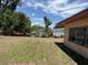 This is a view of the large backyard of this home, complete with a partial fence at 902 Marshall St, Clearwater, FL 33755