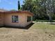 Exterior view of backyard with side wall windows at 902 Marshall St, Clearwater, FL 33755