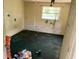 The bedroom has worn-out carpet, damaged walls, and a distressed interior at 902 Marshall St, Clearwater, FL 33755