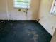 View of a bedroom with stained carpet and walls in need of renovation at 902 Marshall St, Clearwater, FL 33755