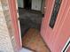 View through the pink front door to the tile foyer inside the home at 902 Marshall St, Clearwater, FL 33755