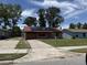 Charming single-story brick home with solar panels, a one-car garage and a well-maintained lawn at 902 Marshall St, Clearwater, FL 33755