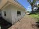 Exterior shot of home with peeling paint and yard covered with dried leaves at 902 Marshall St, Clearwater, FL 33755