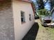 Side view of the house featuring windows and a painted wall surface at 902 Marshall St, Clearwater, FL 33755
