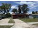 Charming single-story brick home with solar panels, a one-car garage and a well-maintained lawn at 902 Marshall St, Clearwater, FL 33755