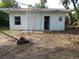 Detached garage needing repair showing open doorway and ladder at 902 Marshall St, Clearwater, FL 33755