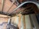 Interior image shows the ceiling with wood beams and wiring, plywood walls and shelves at 902 Marshall St, Clearwater, FL 33755