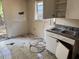 The kitchen's worn cabinets, and dated fixtures need renovation at 902 Marshall St, Clearwater, FL 33755