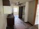 Outdated kitchen featuring laminate countertops, tile flooring and older appliances in a distressed state at 902 Marshall St, Clearwater, FL 33755