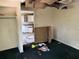 View showcases a room with damaged ceilings, aged cabinets, and worn flooring at 902 Marshall St, Clearwater, FL 33755
