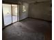 Living room with sliding glass doors and a ceiling fan at 902 Marshall St, Clearwater, FL 33755