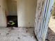 Image displays damaged floors, walls, and discarded materials at 902 Marshall St, Clearwater, FL 33755