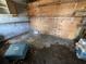 Image of bare room showing plywood walls, concrete blocks and storage space at 902 Marshall St, Clearwater, FL 33755