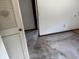 Unfinished room featuring closet and access to the adjoining room at 902 Marshall St, Clearwater, FL 33755