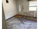 Unfinished room featuring a front door with decorative glass and window with exterior view at 902 Marshall St, Clearwater, FL 33755