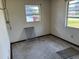 Empty room with two windows and an electrical outlet, revealing the home's potential at 902 Marshall St, Clearwater, FL 33755