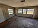 Sun room features many windows and wood paneled walls at 902 Marshall St, Clearwater, FL 33755