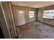 Sun room features many windows and an exterior door at 902 Marshall St, Clearwater, FL 33755