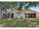 Backyard featuring covered patio and screened-in porch at 10435 Deerberry Dr, Land O Lakes, FL 34638