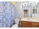 Full bathroom with shower/tub combo, vanity, and tile flooring at 10435 Deerberry Dr, Land O Lakes, FL 34638