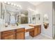 Bright bathroom featuring double vanity sinks, ample counter space, and a luxurious walk-in shower at 10435 Deerberry Dr, Land O Lakes, FL 34638