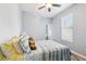 Serene bedroom with neutral paint and natural light coming through window at 10435 Deerberry Dr, Land O Lakes, FL 34638