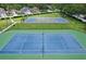 Overhead shot of the community tennis and basketball courts, perfect for outdoor activities and neighborhood fun at 10435 Deerberry Dr, Land O Lakes, FL 34638