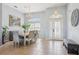 Formal dining room featuring tile flooring, pendant lights, and a large window at 10435 Deerberry Dr, Land O Lakes, FL 34638