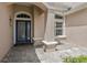 Welcoming front entrance with an elegant glass-paneled door and stone pathway at 10435 Deerberry Dr, Land O Lakes, FL 34638