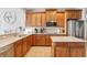 Spacious kitchen with ample cabinetry, stone countertops, and stainless steel appliances at 10435 Deerberry Dr, Land O Lakes, FL 34638