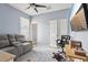 Comfortable living room with seating and natural light coming through windows at 10435 Deerberry Dr, Land O Lakes, FL 34638