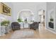 Open living space featuring tile flooring, modern lighting, and arched doorways at 10435 Deerberry Dr, Land O Lakes, FL 34638