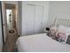 Bright bedroom featuring LVP flooring and a comfortable bed with decorative pillows at 10573 Oakside Dr, Palmetto, FL 34221
