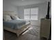 Bedroom with bed, dresser and modern flooring at 10573 Oakside Dr, Palmetto, FL 34221