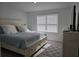 Bedroom with bed, dresser and modern flooring at 10573 Oakside Dr, Palmetto, FL 34221