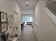Hallway view showing decor and the open floor plan that connects to a dining area and living room at 10573 Oakside Dr, Palmetto, FL 34221