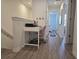 Landing with desk, chair, and printer with view into bedroom at 10573 Oakside Dr, Palmetto, FL 34221