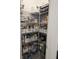 Well-organized pantry with labeled storage containers and baskets on wire shelves at 10573 Oakside Dr, Palmetto, FL 34221