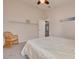 Cozy bedroom featuring a rattan chair, soft carpet, ceiling fan, and a comfortable bed perfect for relaxation at 11078 Heathrow Ave, Spring Hill, FL 34609