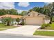 Charming single-Gathering home with a two-car garage, well-maintained lawn, and attractive landscaping at 11078 Heathrow Ave, Spring Hill, FL 34609
