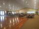 Spacious meeting room with tables, chairs, and a dance floor perfect for community events at 11078 Heathrow Ave, Spring Hill, FL 34609