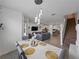 Open-concept view from the dining area showcasing the living room, kitchen, and staircase at 11287 Cay Spruce Way, San Antonio, FL 33576
