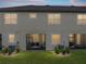 Rear exterior view showcases windows to unit's living spaces at 11287 Cay Spruce Way, San Antonio, FL 33576