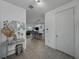 Bright and inviting foyer leading to an open-concept living space with modern decor and tile floors at 11287 Cay Spruce Way, San Antonio, FL 33576