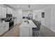 Spacious kitchen featuring a large island with seating, stainless steel appliances, and ample cabinet space at 11287 Cay Spruce Way, San Antonio, FL 33576
