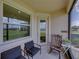 Cozy lanai seating and a relaxing atmosphere to enjoy the outdoors at 11287 Cay Spruce Way, San Antonio, FL 33576